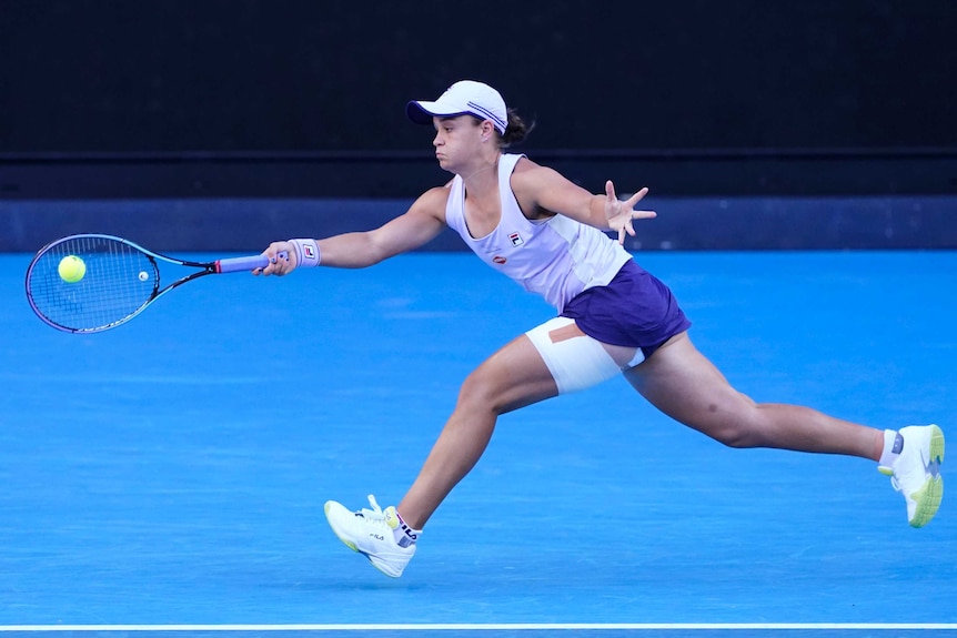 Ash Barty stretches for a forehand against Ekaterina Alexandrova.