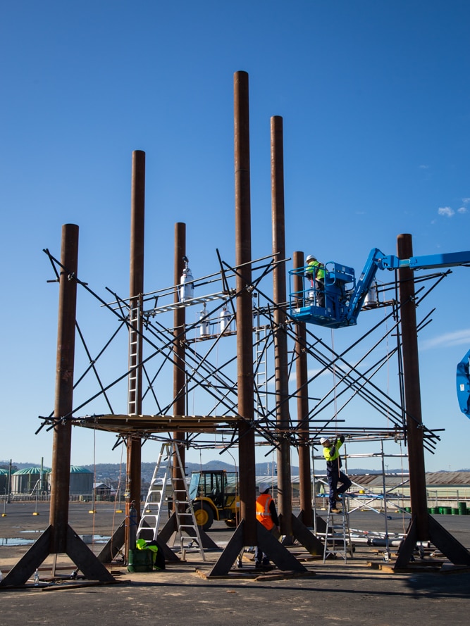 Workers set up the harmonically tuned Fire Organ engineered by Bastiaan Maris with resonators and flame throwers for Dark Mofo.