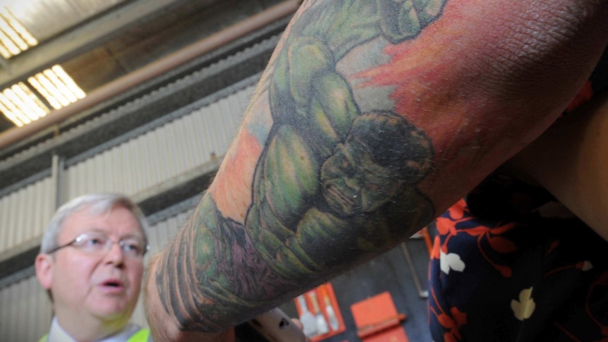 A tattoo of the Hulk is seen on a journalist's arm during a Kevin Rudd press conference