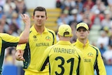 Australia's Josh Hazlewood high-fives two of his teammates during the ICC Champions Trophy match between Australia and NZ.