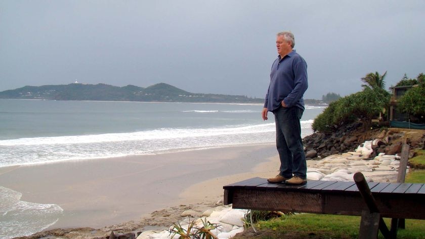 John Vaughan inspects his beachfront property at Belongil