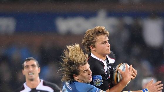 Wynand Olivier wraps up Patrick Lambie during the Bulls' come-from-behind victory.