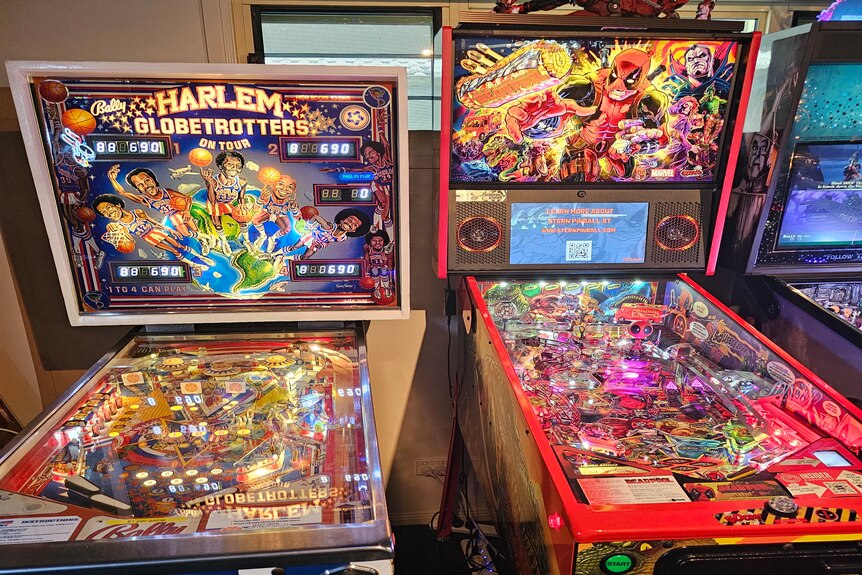 Harlem pinball machine next to deadpool pinball machine