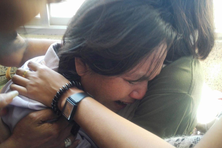 Thai student's mother cries outside court after the court.