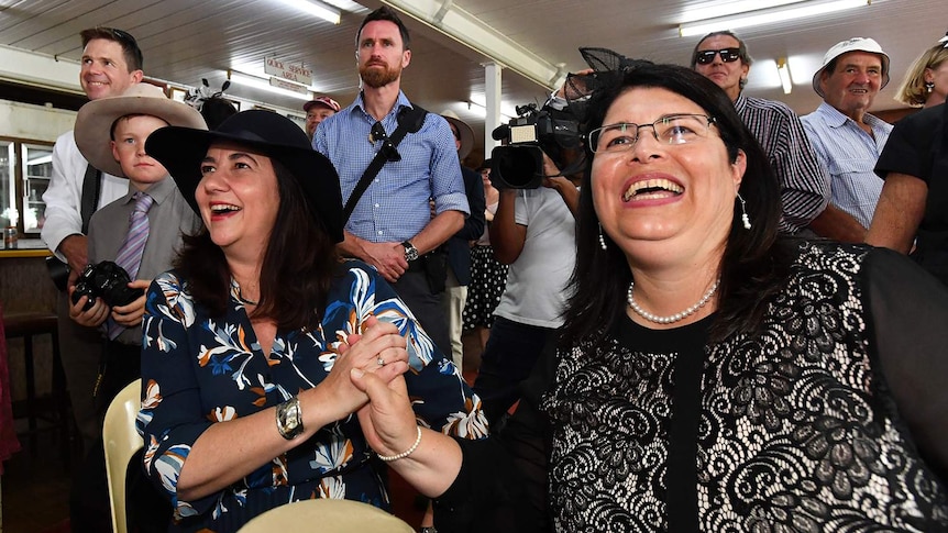 Premier Annastacia Palaszczuk (left) and Racing Minister Grace Grace (right) watch the Melbourne Cup at Kumbia Race Club.