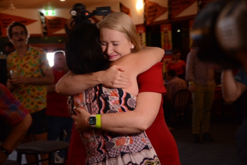 Treasurer Nicole Manison hugs Health Minister Natasha Fyles at the 2020 Labor election headquarters on election night.