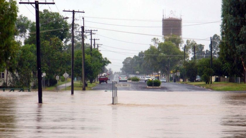 Floodwaters cover Little Parry Street in Charleville