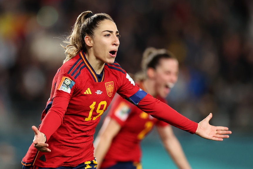 Olga Carmona runs with her arms out celebrating a Women's World Cup semifinal goal against Sweden.