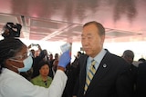 Ban Ki-moon gets his temperature checked in Liberia