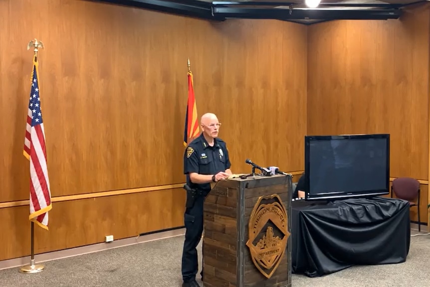 Tucson police chief Chris Magnus speaking behind lectern