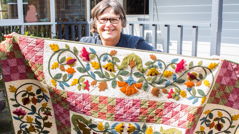 Deirdre Bond-Abel with her quilt, Ashmore.