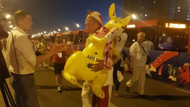 A Polish fan carrying a kangaroo.