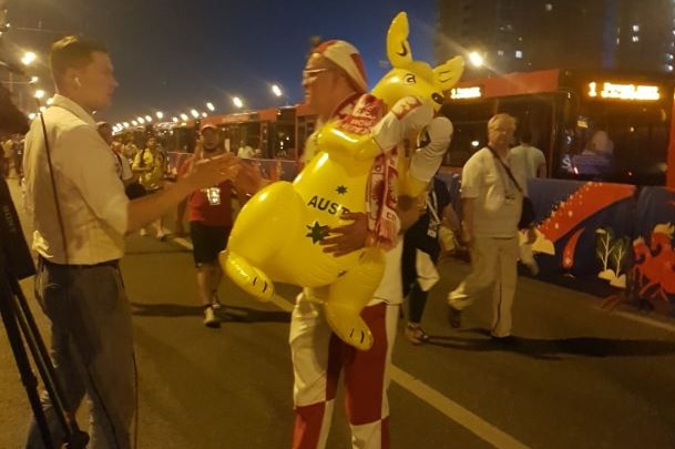 A Polish fan carrying a kangaroo.