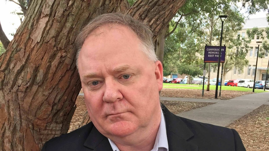 Steve Fisher under a tree.