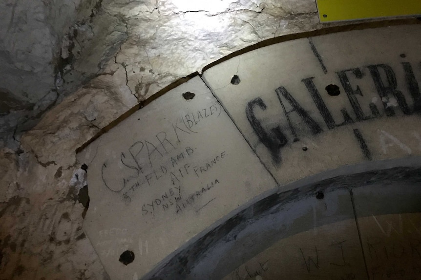 The signature of Australian soldier S. Sparks etched on the arch of doorway.