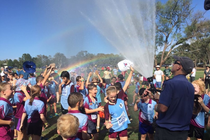 ACT Fire Rescue hoses down kids during heatwave