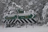 Road signs covered in snow
