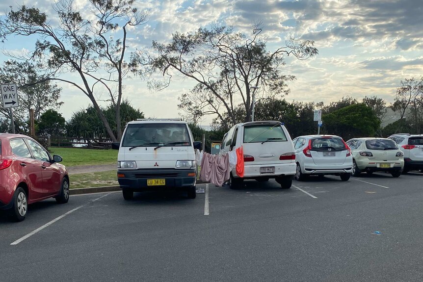 Campers hanging out their washing in a car park in Byron Bay.