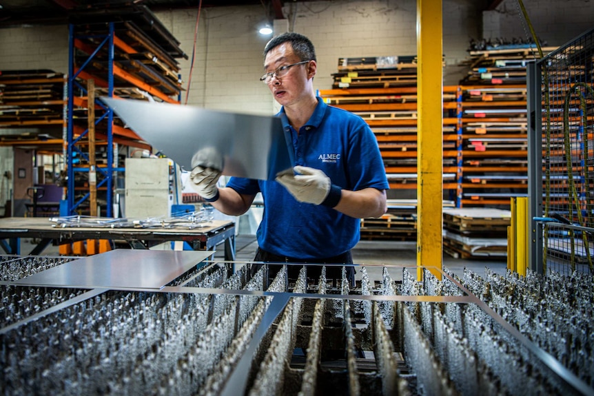 An Almec worker in the middle of the steel fabrication process