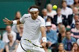 Rafael Nadal won in straight sets to book a place in the second round at Wimbledon.