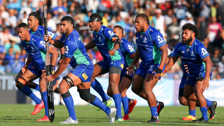 A group of Fijian rugby players perform a war dance before a match
