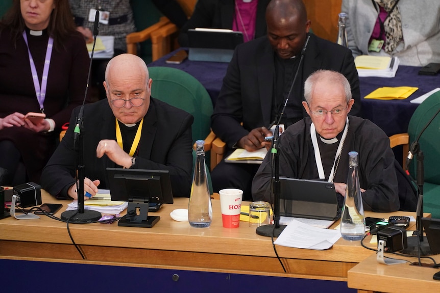 The Archbishop of York Stephen Cottrell and The Archbishop of Canterbury Justin Welby sitting with each other at a meeting