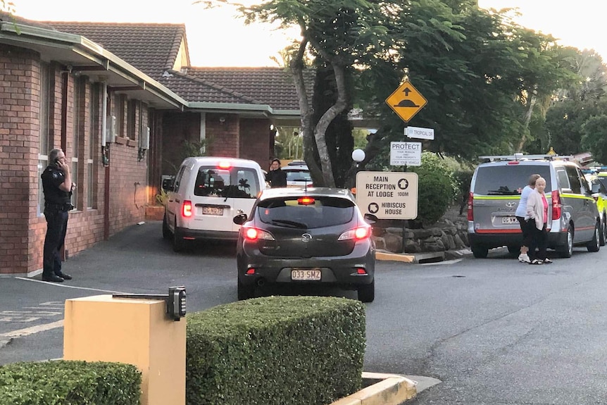 Residents and emergency authorities outside a nursing home