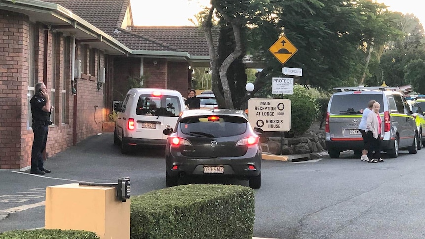 Residents and emergency authorities outside a nursing home