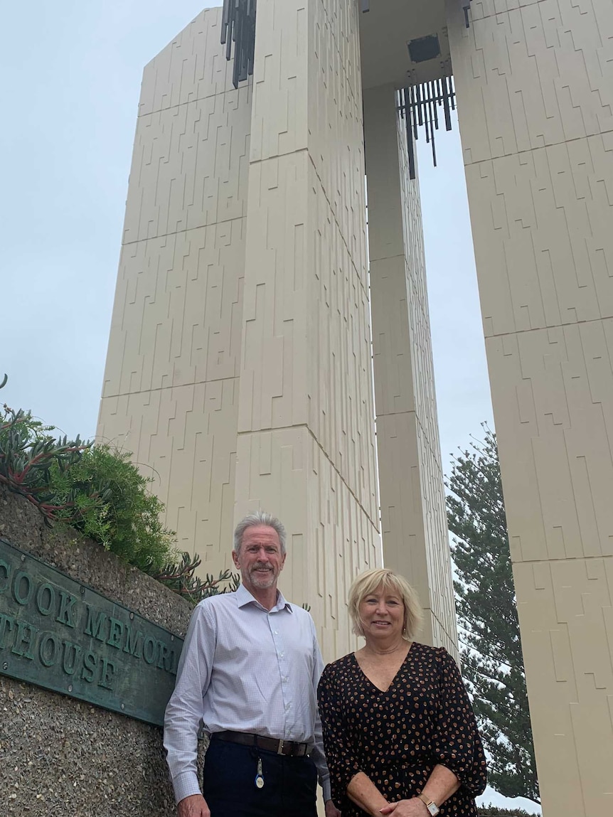 Gold Coast City Councillor Gail O'Neill and Tweed Shire Council's Stewart Brawley in front of the Point Lookout lighthouse