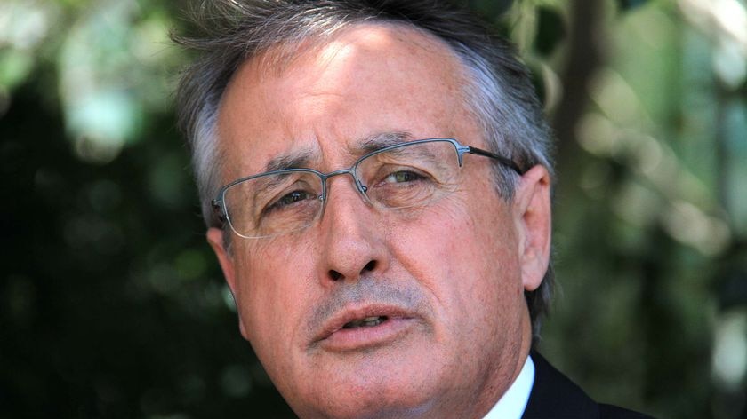 Federal Treasurer Wayne Swan speaks at a press conference at Waterfront Place in Brisbane