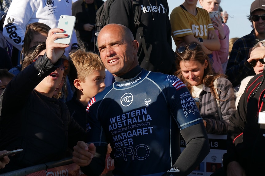 Kelly Slater with a fan