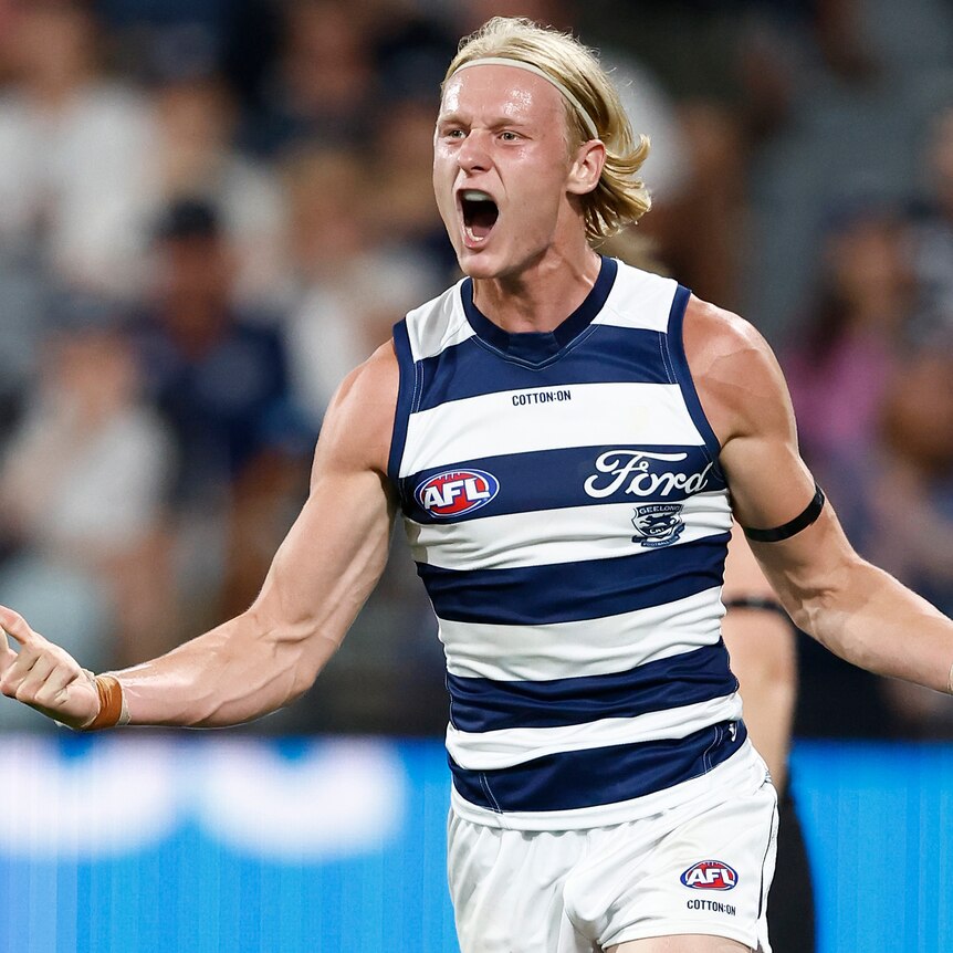 Ollie Dempsey celebrates during Geelong's round-one AFL win over St Kilda.