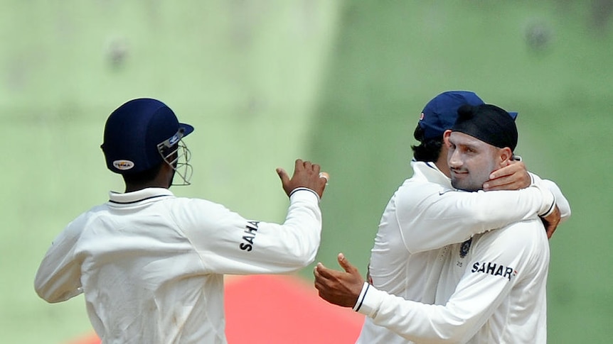 Harbhajan Singh (r) celebrates after bowling Carlton Baugh for 60.