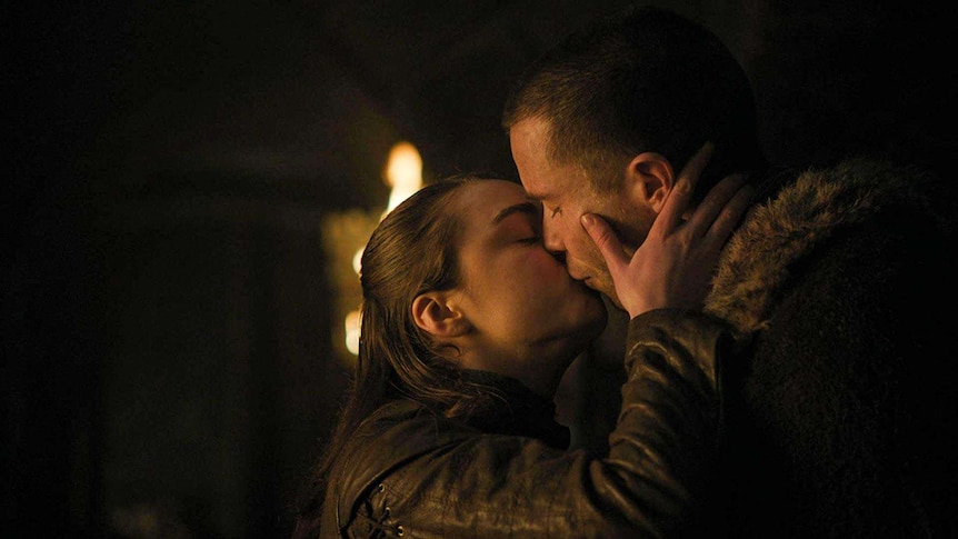 Arya Stark and Gendry, played by Maisie Williams and Joe Dempsie, kiss in a scene from HBO's Game of Thrones
