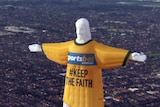 Hot air balloon depicting Jesus with a sportsbet logo flying over Melbourne's suburbs.