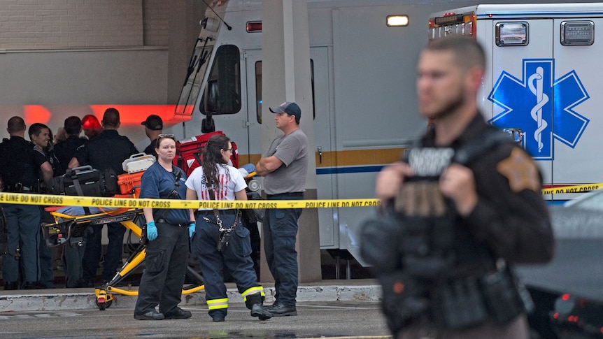 Emergency personnel gathered after a shooting at a mall.