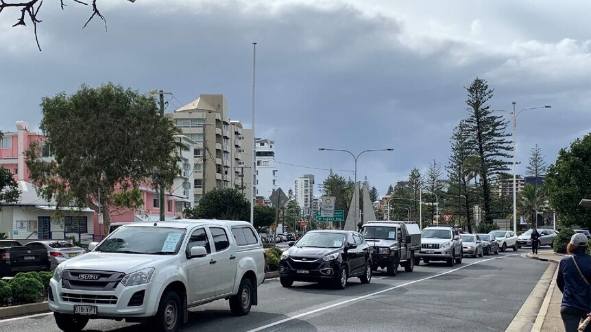 A line-up of cars at Coolangatta after the Queensland border opened.