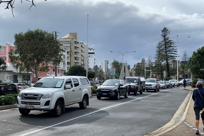 A line up of cars at Coolangatta after the Queensland border opened.