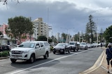 A line-up of cars at Coolangatta after the Queensland border opened.