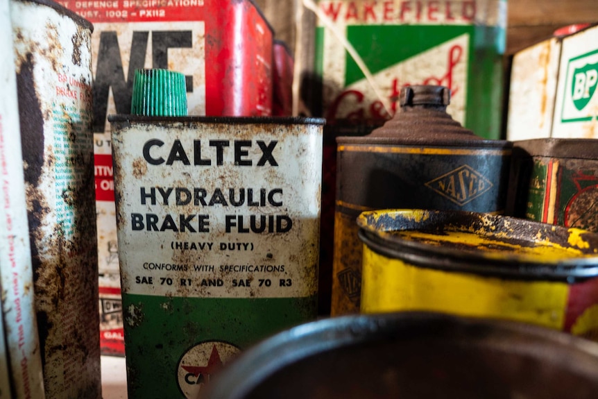 Old motor oil tins in John Price's shed