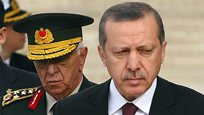 Chief of staff General Isik Kosaner (L) stands next to Turkish prime minister Tayyip Erdogan in Ankara on November 30, 2010.