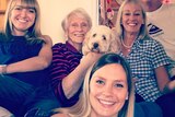 Rebecca Armitage takes a selfie with her family, including her sister, grandma, mum, dad and family dog