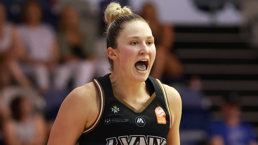 A Perth Lynx WNBL player celebrates during opening game of grand final series against Southside Flyers.
