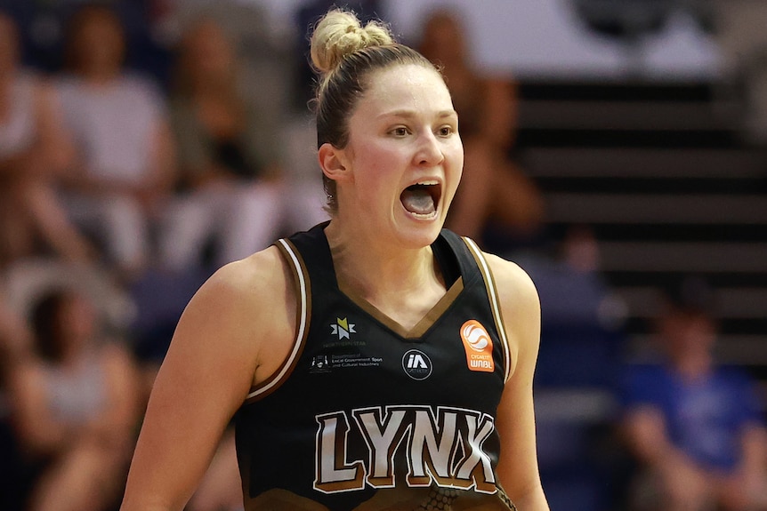 A Perth Lynx WNBL player celebrates during opening game of grand final series against Southside Flyers.