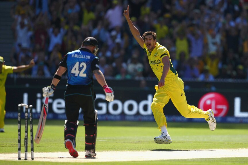 Mitchell Starc celebrates bowling Brendon McCullum in the World Cup final