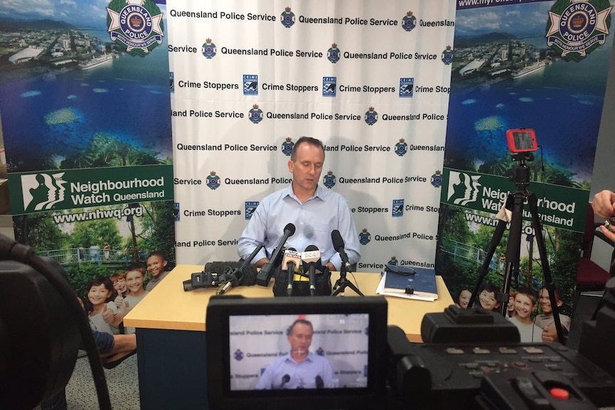 A policeman holding a press conference.