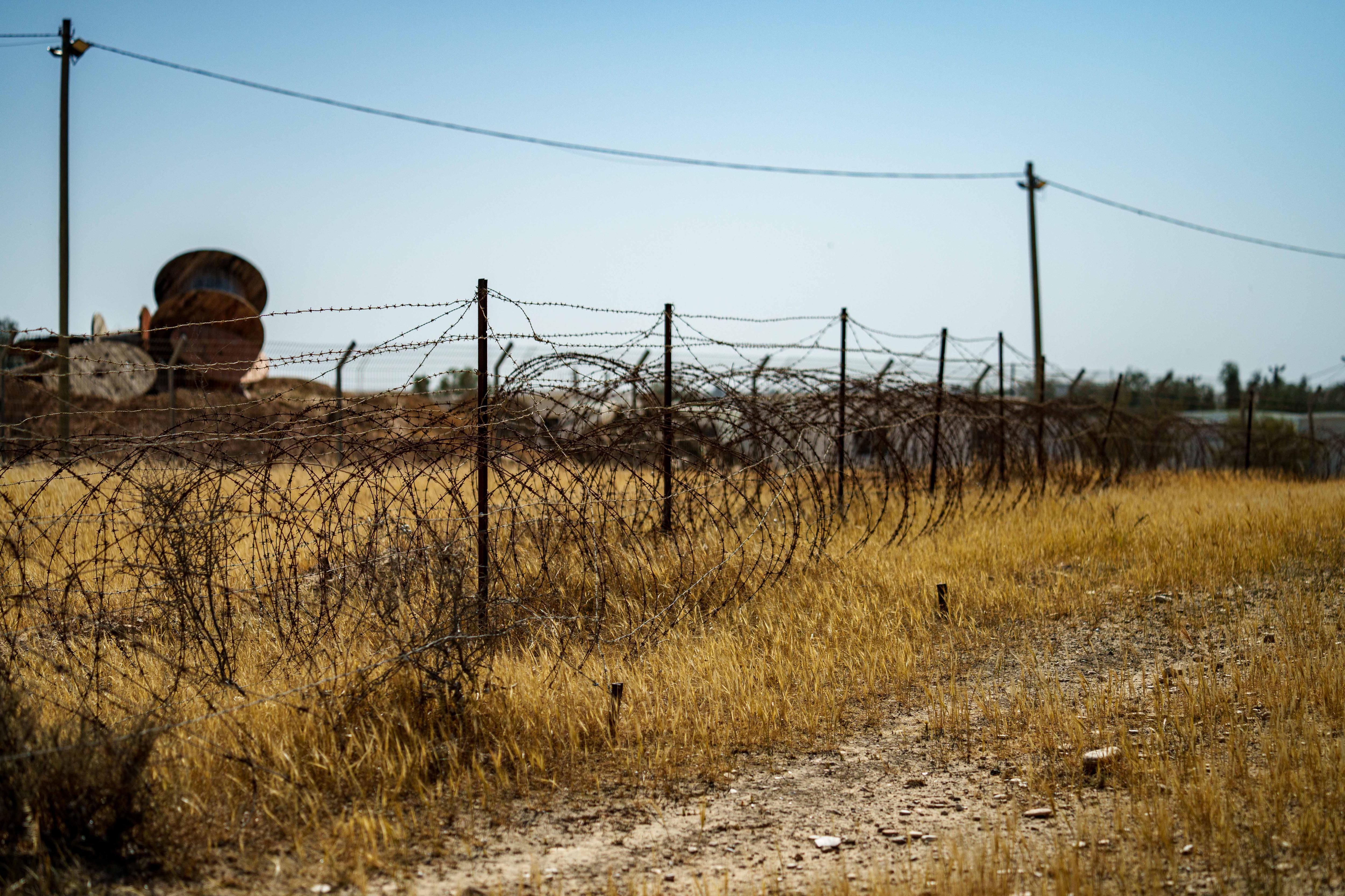 Barbed wire in an arid field 