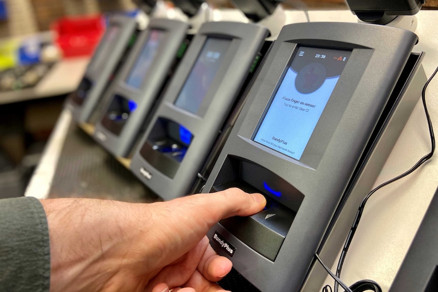 A bank of bundy clocks lined up at Australian manufacturer BundyPlus.