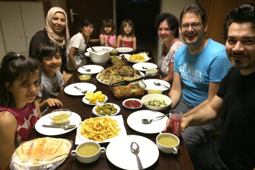 Peter Rieder, his wife and daughter celebrate Eid with their ‘guest’ family, the Hafis.
