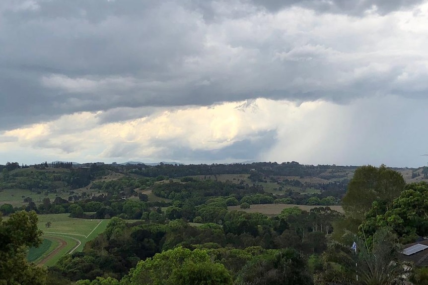 Storm clouds over an inland rural area.